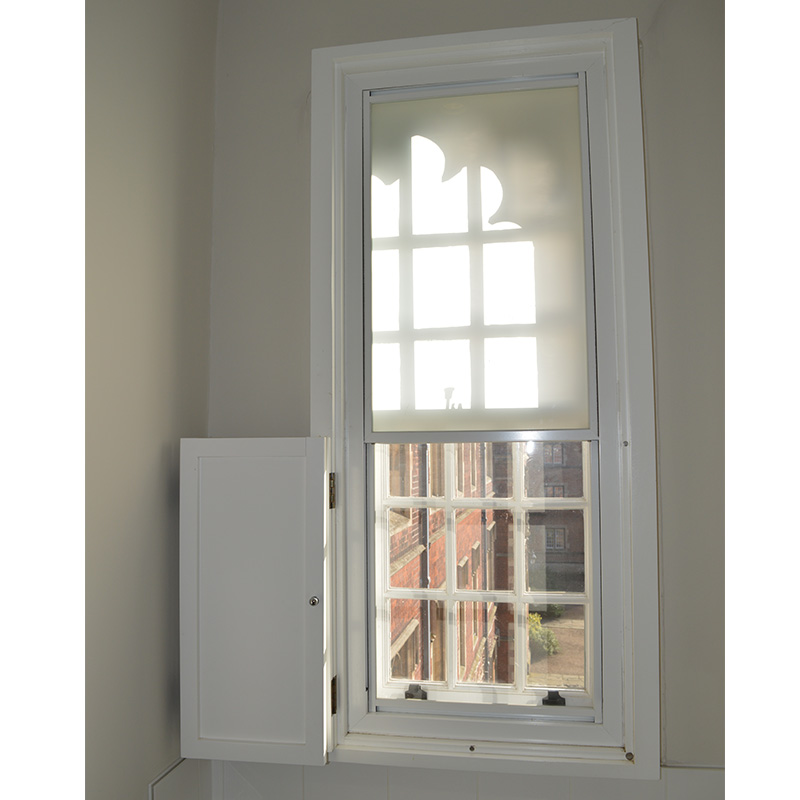 Obscure secondary double glazing for privacy in toilets at Jesus college.