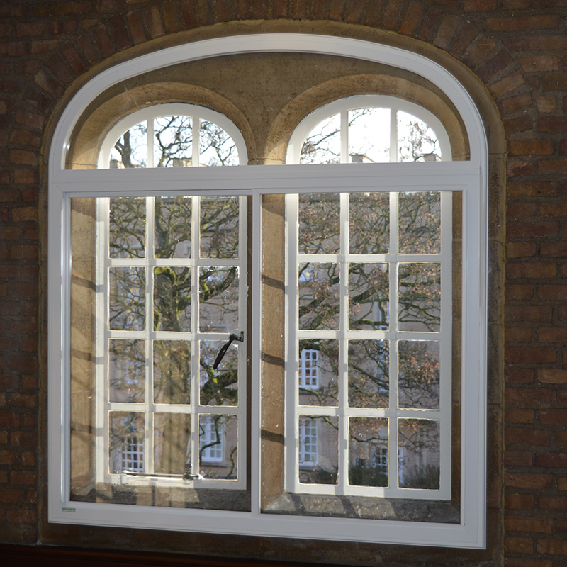 Large arched feature window with Selectaglaze secondary double glazing casements