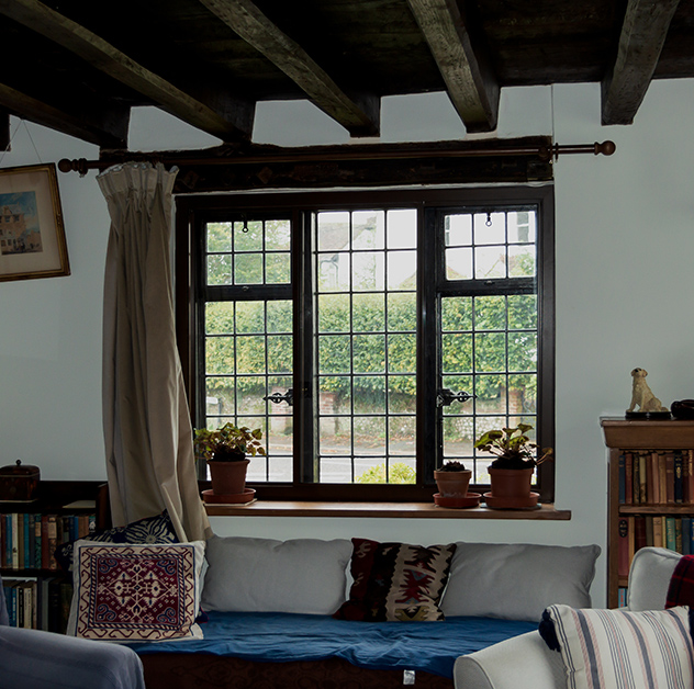 Acoustic and thermal secondary glazing in a living room in a house in the South Downs