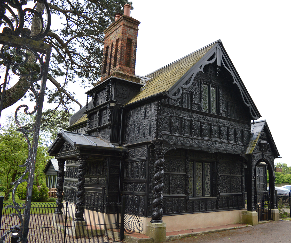 The exterior of a wood panelled 19th c entrance lodge exterior