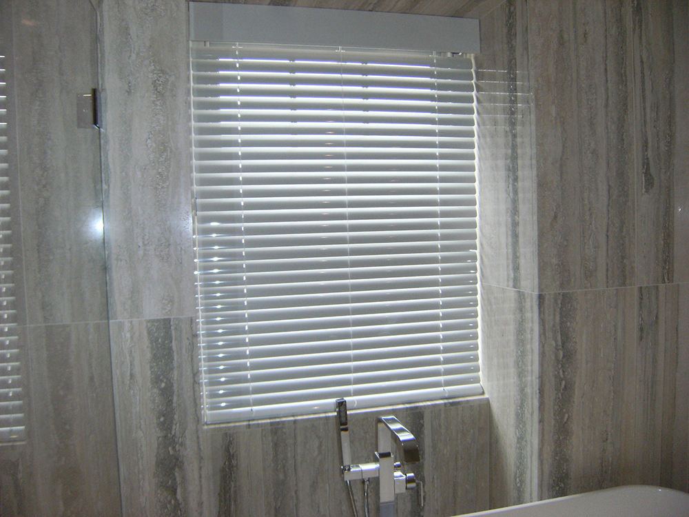 Marble tiles bathroom and window surround which needs secondary glazing