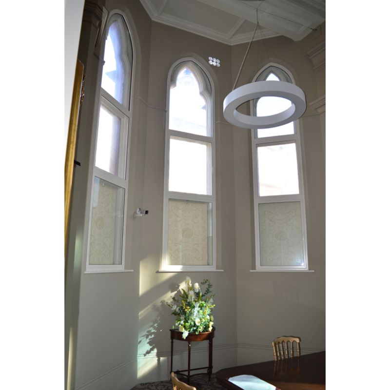 Three large Gothic arched primary windows treated with a combination of secondary glazing units to ensure the perfect acoustic insulation