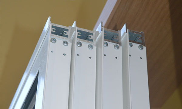 Selectaglaze secondary glazing systems with pre fixed mullions, to enable rapid installation on site, onto pre-set timber grounds in a sweeping curved bay at Plumstead Library