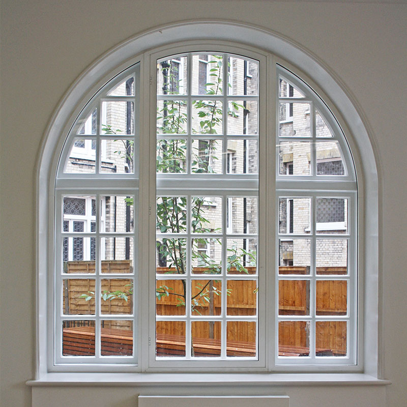 Beautiful curved arch original primary treated with bespoke secondary double glazing unit