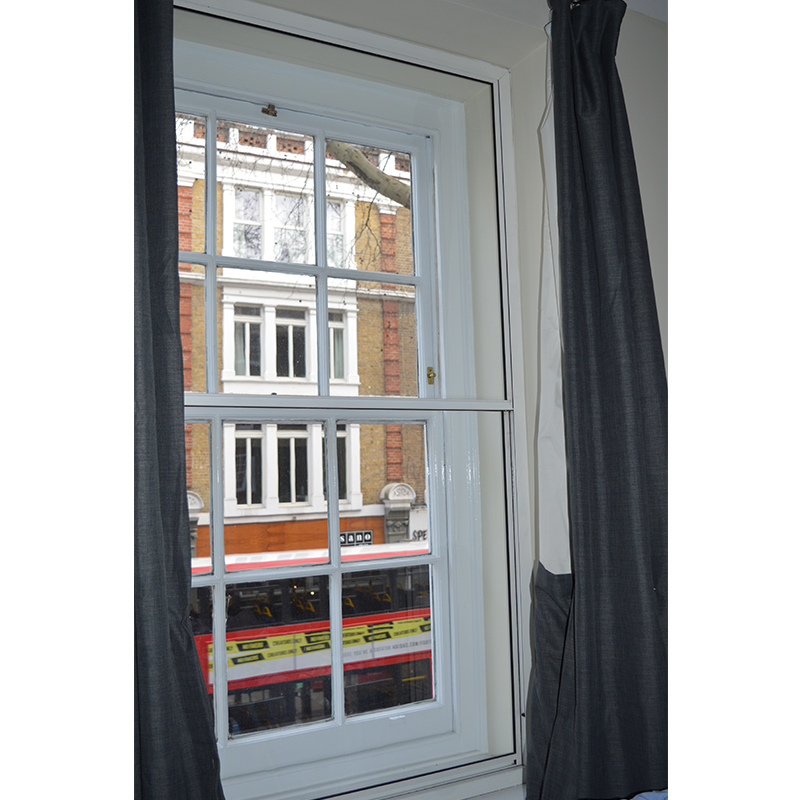 Acoustic insulation secondary glazing in Gray's Inn bedroom over looking Gray's Inn Road