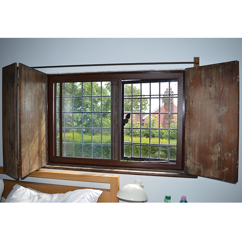 Bronze secondary glazing with original wooden shutters