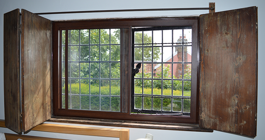 A walnut finished secondary glazing VS