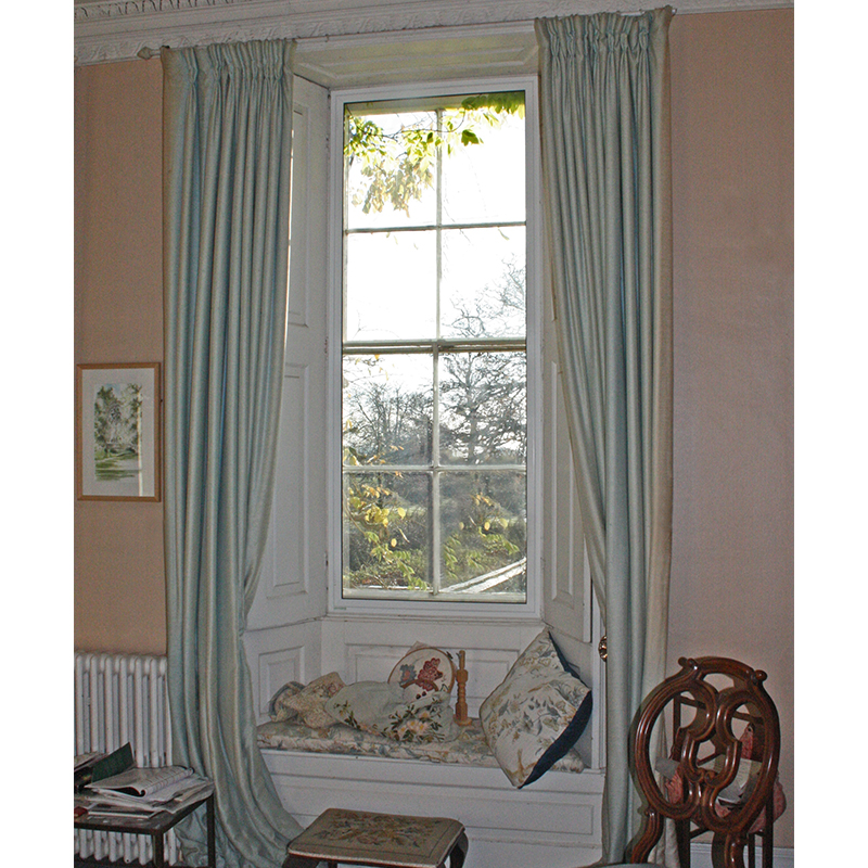 Window seat niche with heat retaining secondary glazing for a grade 2 listed residence