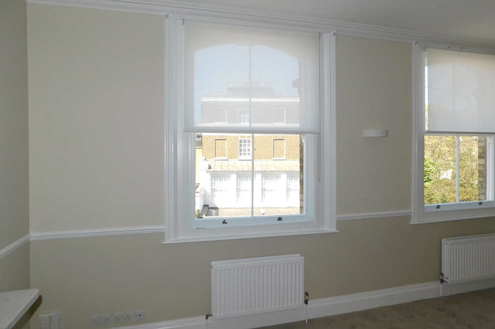 Box sash windows with roller blinds fitted with Selectaglaze secondary glazing to raise thermal and acoustic performance