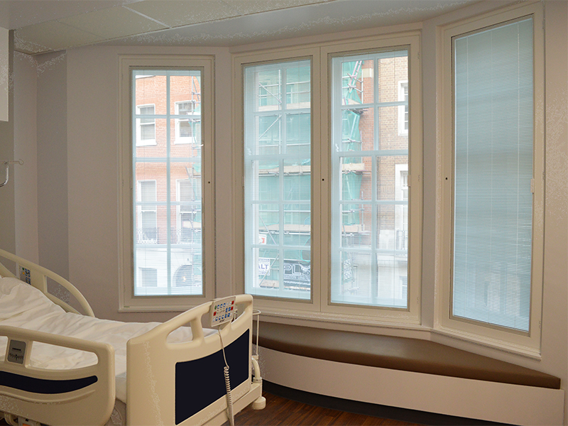 Sealed unit secondary glazing casements with integral blinds. Patient privacy and sound insulation at Fortius Clinic, Bentinck Street