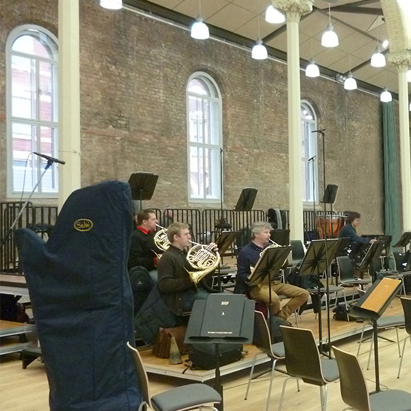 One centred full radius head secondary glazing to Halle Orchestra