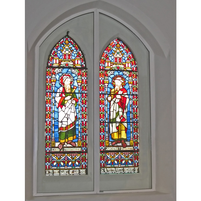 Arched head stained glass window as Latymer and Godolphin School performing arts space with secondary double glazing