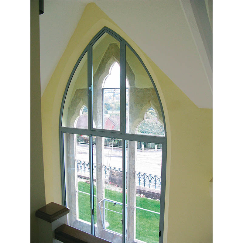 Gothic arched secondary glazing in Northleze Primary School residential conversion