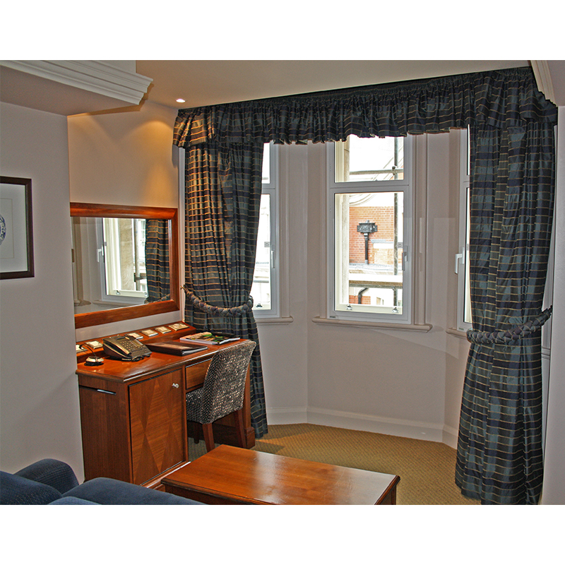 Bay window in a suite treated with secondary glazing for noise reduction