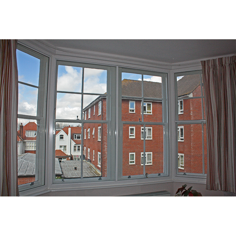 Large bay window treated with horizontal sliding secondary  double glazing
