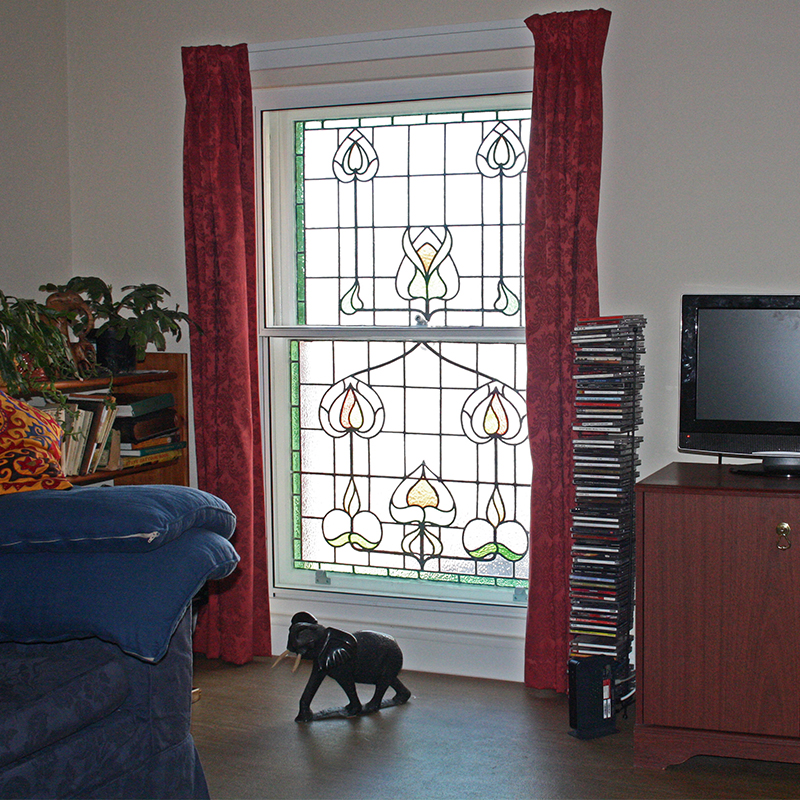 Large stained glass window protected by secondary glazing