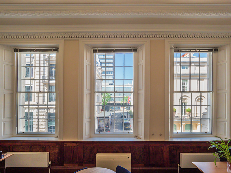 Victorian windows with pinned timber shutters - university