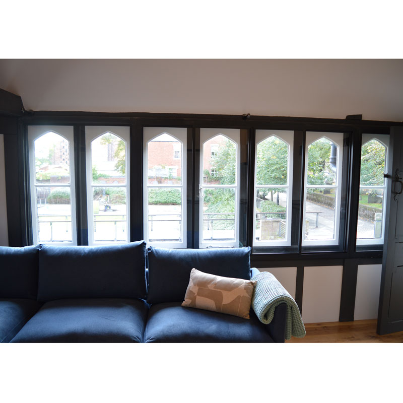 Black framed secondary glazing installed in Lychgate Cottages