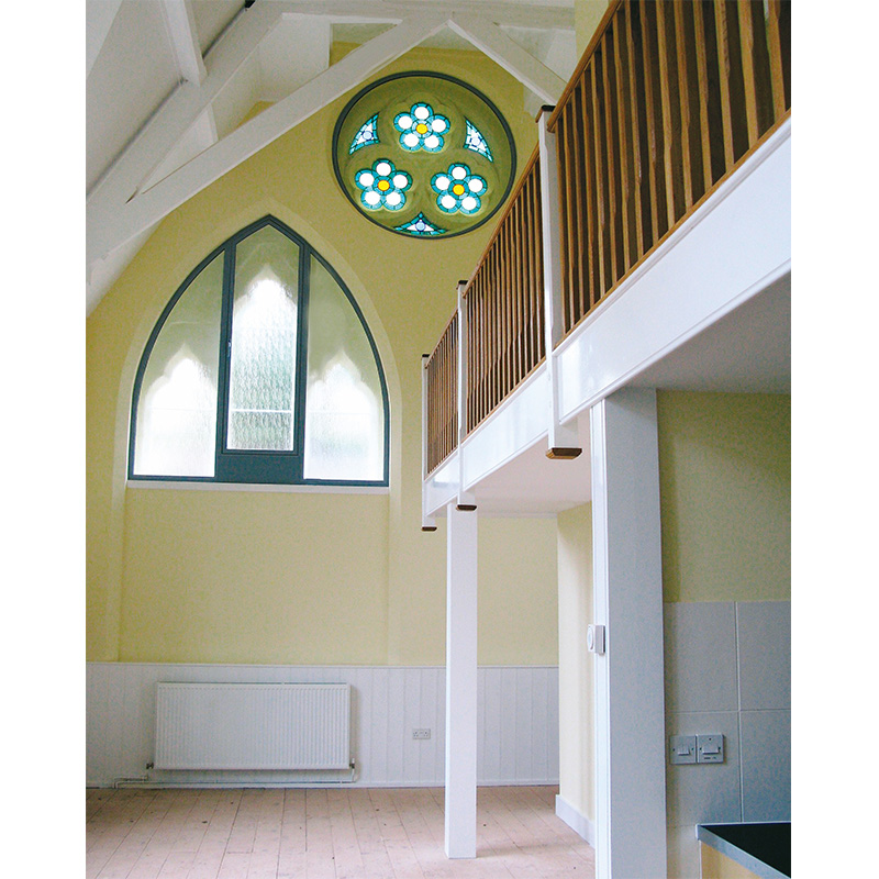 Arched window and round window treated with secondary double glazing