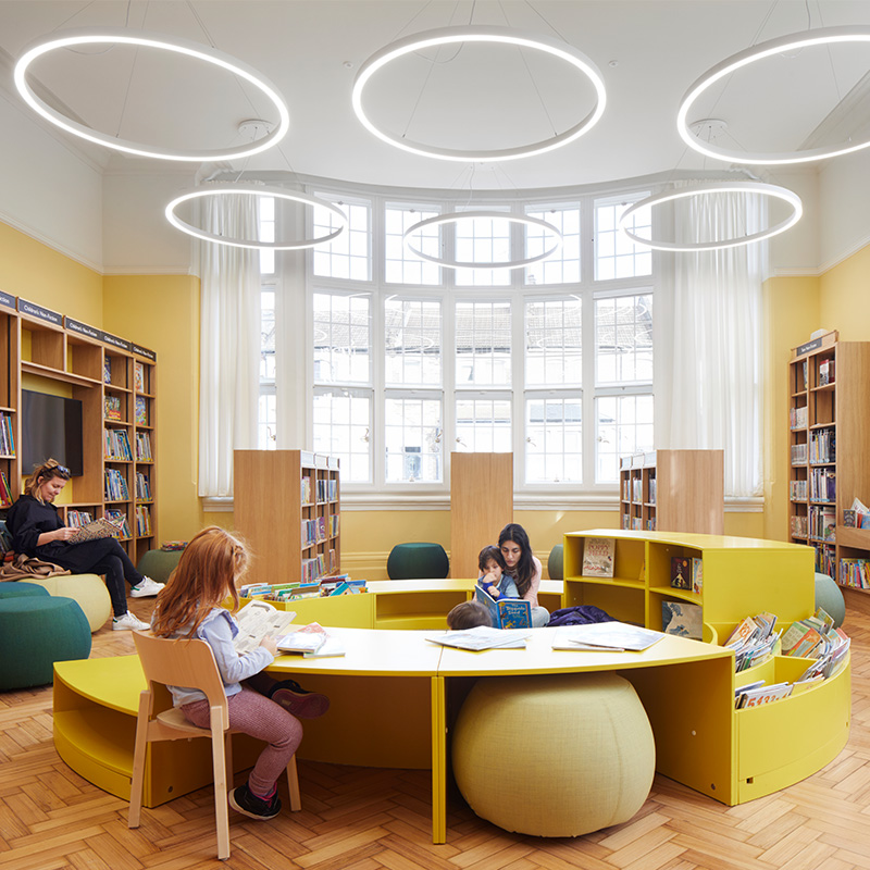 Internal view of the large sweeping bow windows with retrofit Selectaglaze secondary glazing, making Plumstead Library's reading room more energy efficient and acoustically sound.