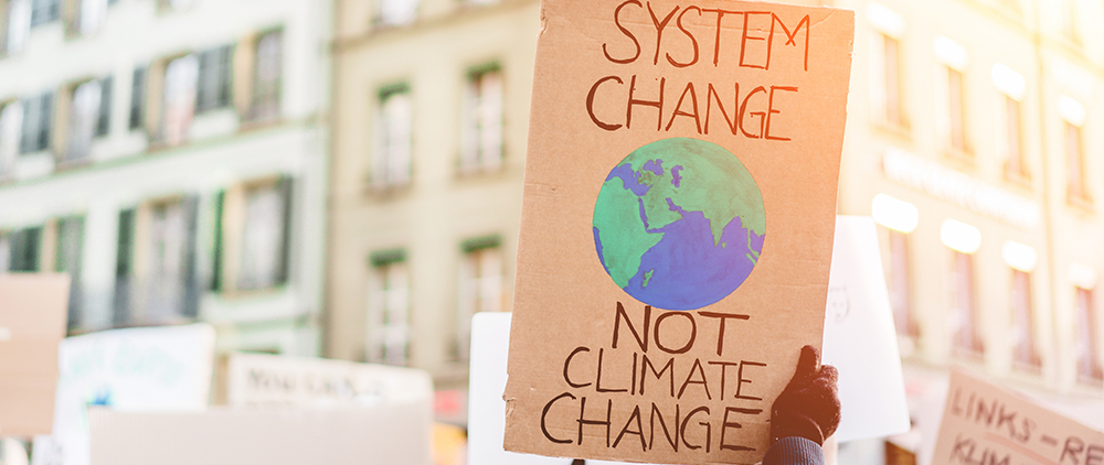 Protest about environmental change - RIBA and Architects Declare say system change is needed in the Built for the Environment Report