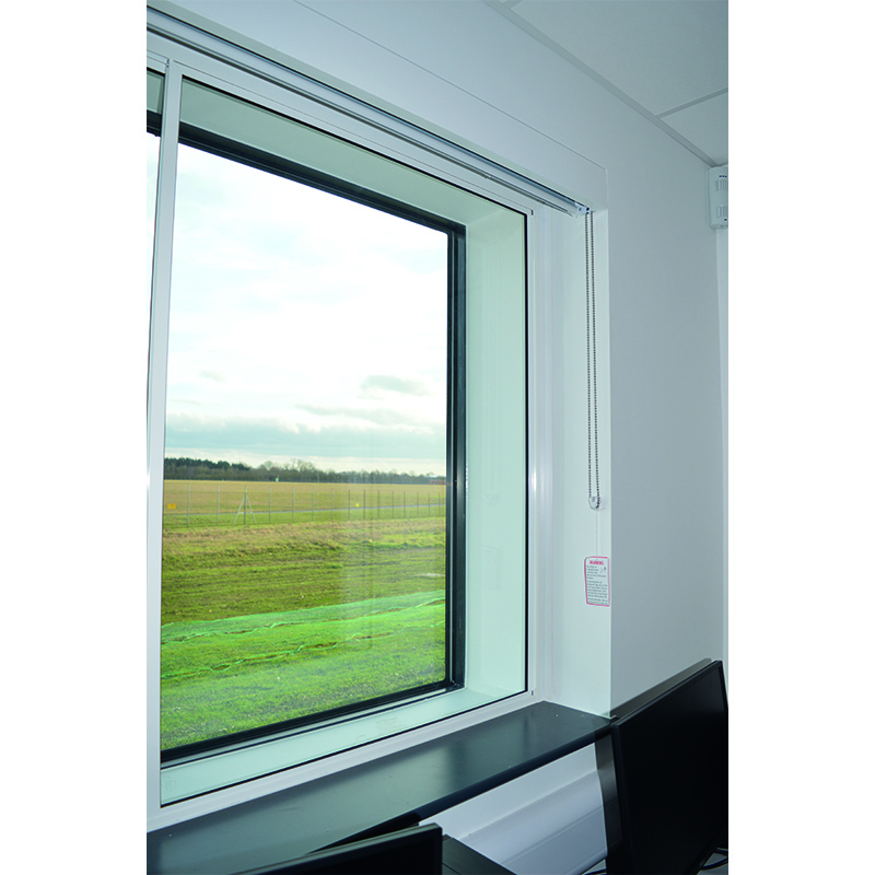 Selectaglaze series 10 horizontal sliding against primary double glazing, to provide acoustic insulation in a college at the end of Stansted Airport runway