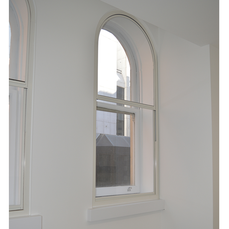 Curved head vertical sliding secondary glazing