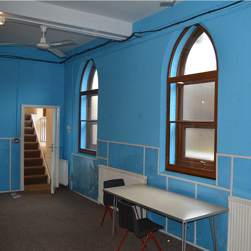 Image showing the cavity between the secondary glazing and primary window, to provide noise containment at a church in south London