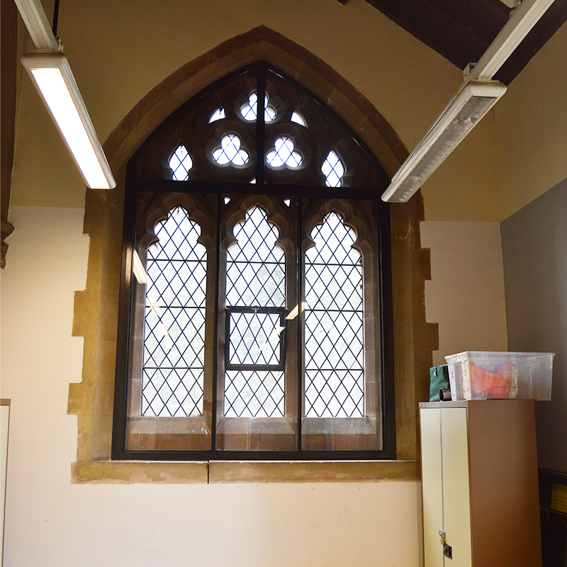 Multi unit secondary glazing to acoustically treat a large arched window in St Philips church, Wolverhampton
