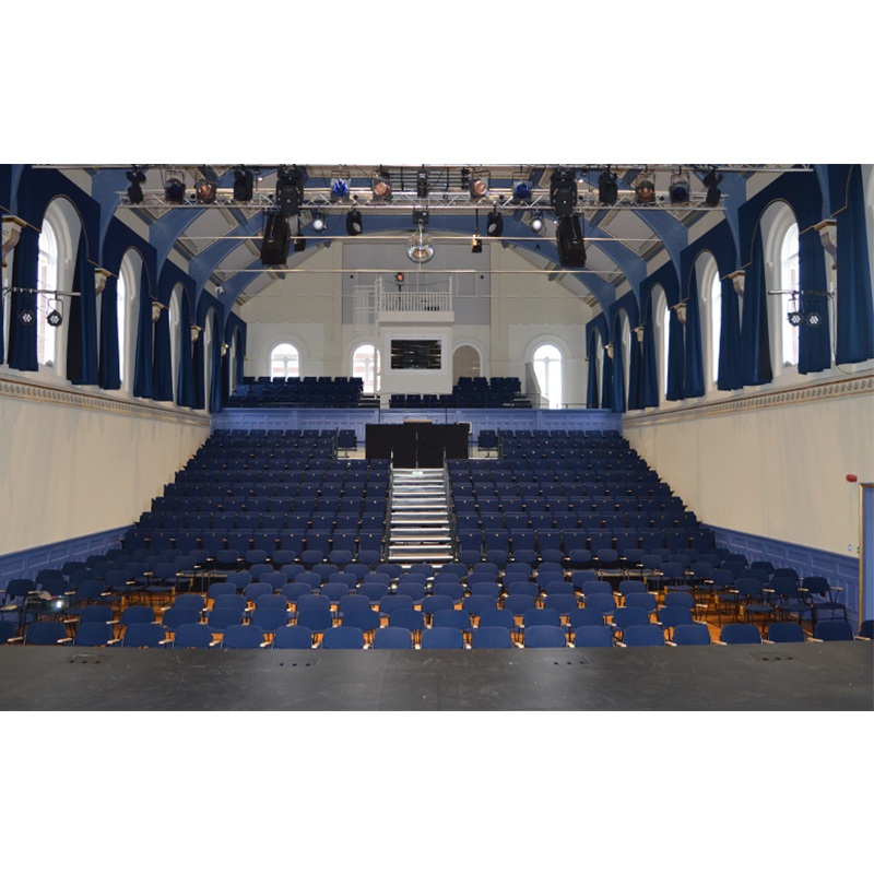 Views from the stage to the auditorium taking in the large secondary glazed arched headed Victorian Grade II Listed windows at Tamworth Assembly Rooms