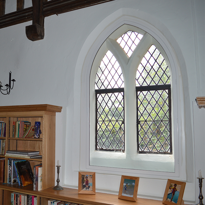 Grade II Listed the Priory with gothic arched head secondary glazing in dining room