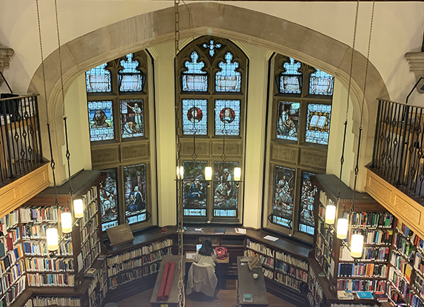 View of the untreated gothic arched windows in a univerity library, which required acoustic insulation and thermal enhancements